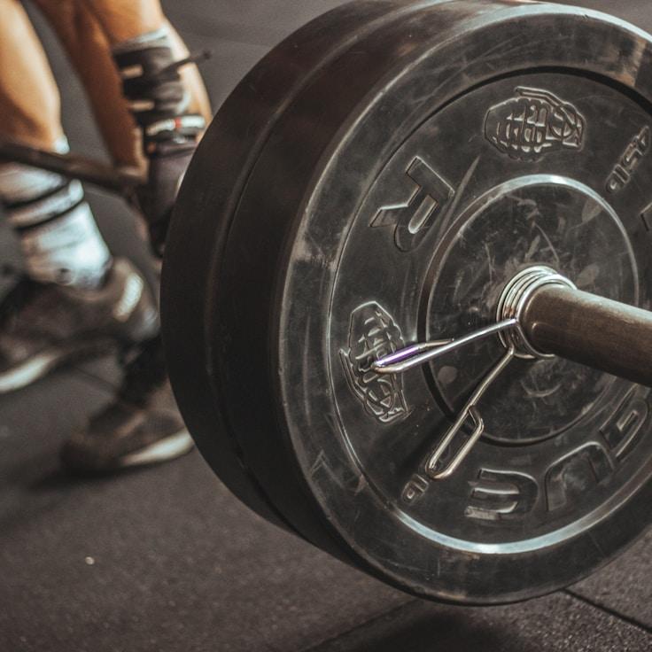 Women in a fitness class doing stretching and mobility exercises